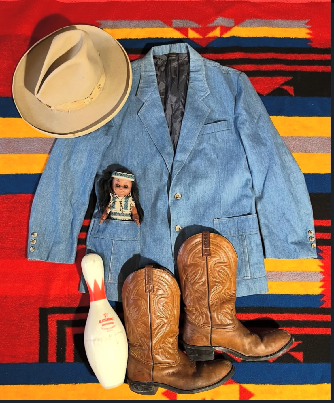 Voodoo's Cowboy flat lay: a 1920s Tom Mix-style hat, a 1990s Levi's denim blazer, and 1970s Red Wing Pecos boots