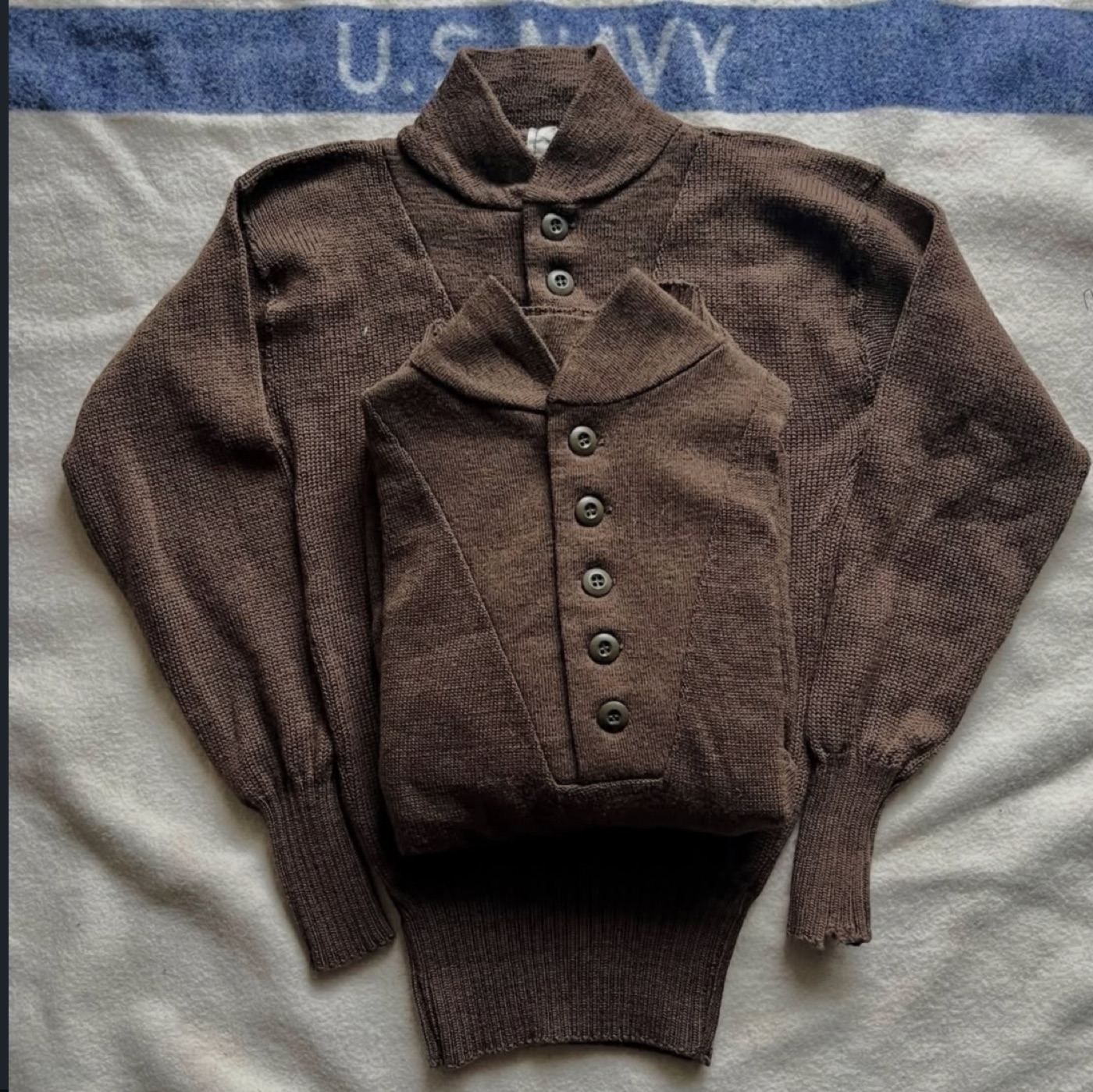 A 1940s-1980s U.S. Army vintage wool sweatshirt, simply designed in understated, workwear-inspired colors